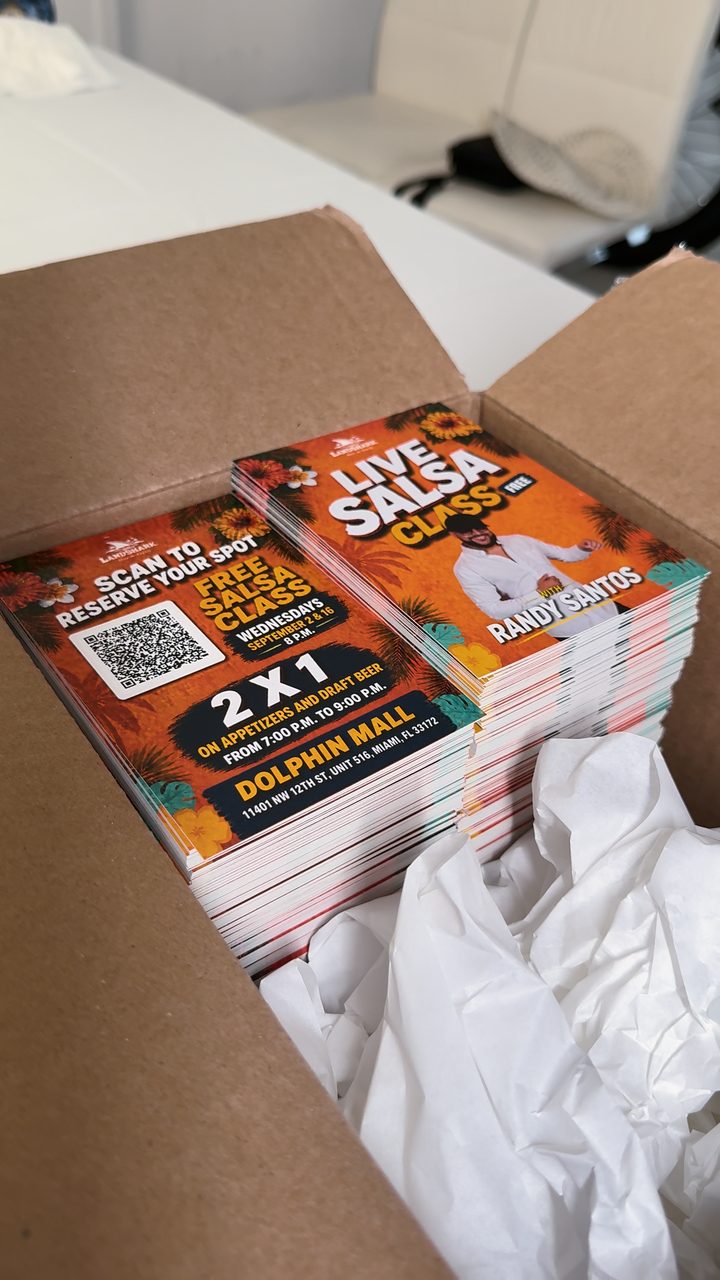 An open box of freshly printed flyers