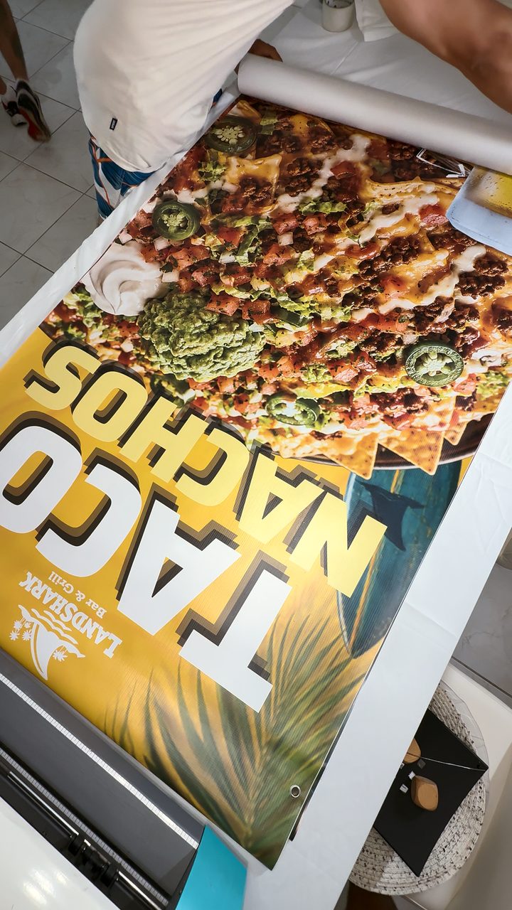 The same banner coming out of the large-format printer